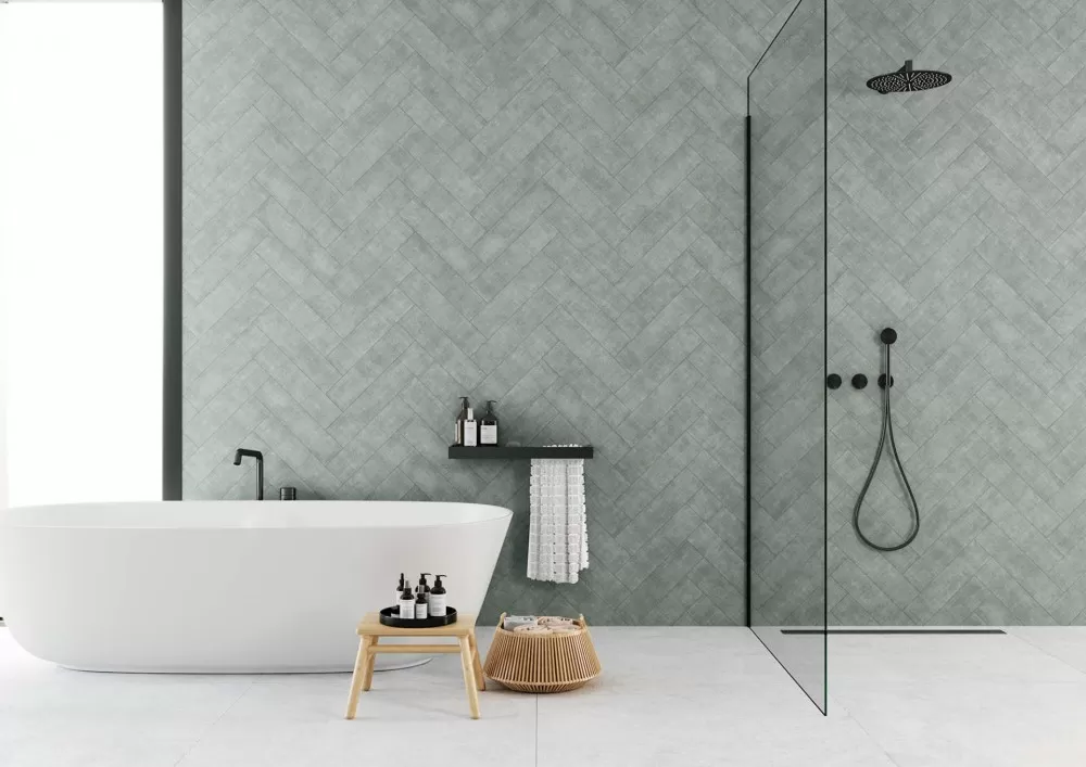 Green Herringbone bathroom wall with bathtub and shower. White floor