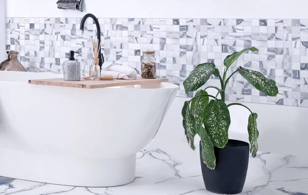 2x2 white and blue bathroom wall with a bathtub. White and blue floor.