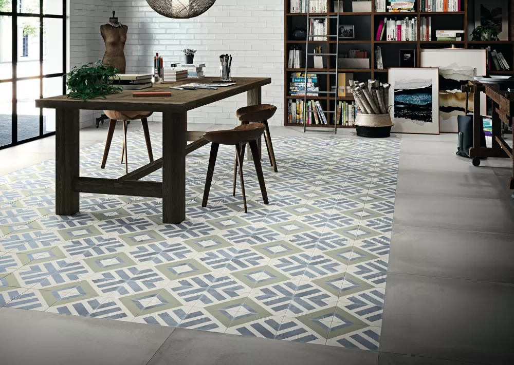 Multicolor floor with a brown office table and a bookshelf on the wall