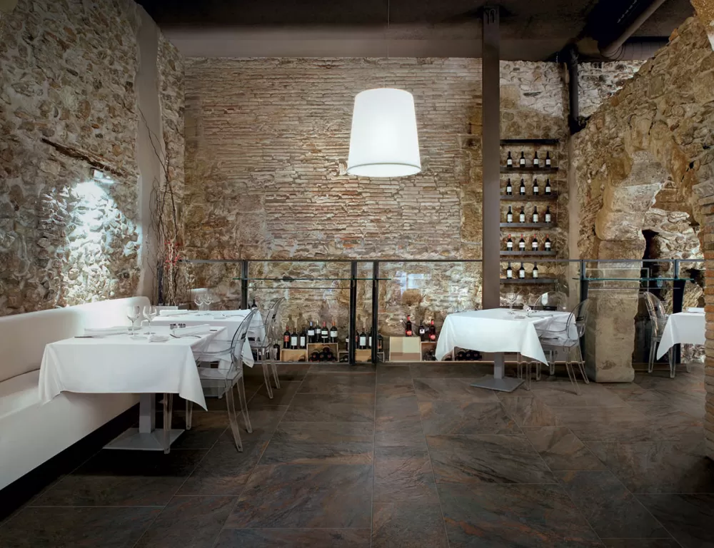 Antique stone restaurant with Place Porcelain tile dark brown floor.