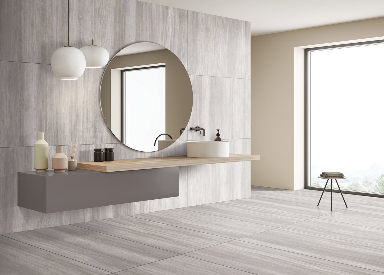 Minimal and modern bathroom with  varigated tiles in taupe and white.